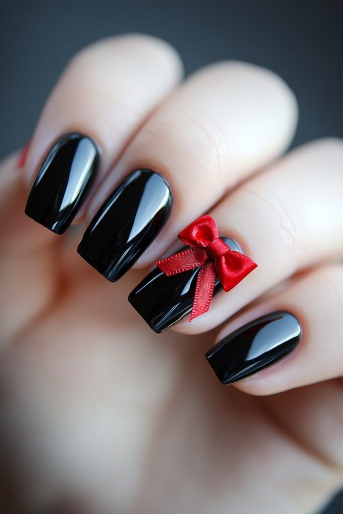 23 Black Nails with Red Bow with Red bow on ring finger